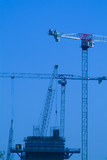 Mining Photo Stock Library - multi level cranes lifting concrete and steel into position on large construction job. generic image. vertical shot ( Weight: 5  New Image: NO)