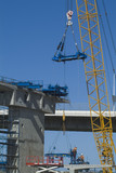 Mining Photo Stock Library - crane lifting scaffold and steel form work into place with workers on major bridge construction project. vertical shot. ( Weight: 4  New Image: NO)