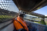 Mining Photo Stock Library - underground coal worker sitting in mine vehicle on the way underground. heavy rail train going past. ( Weight: 4  New Image: NO)