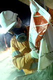Mining Photo Stock Library - construction worker wearing a safety mask works with concrete bags at night.  vertical shot. ( Weight: 4  New Image: NO)
