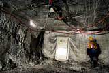 Mining Photo Stock Library - underground coal miner inspecting doorway and back of room with ceiling mesh support above. ( Weight: 5  New Image: NO)