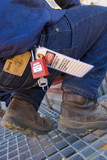 Mining Photo Stock Library - close up of mine worker from the waist down showing safety lock out tags and padlock on belt. ( Weight: 5  New Image: NO)