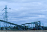 Mining Photo Stock Library - coal conveyor at power station with electricity tower in background. suits landscape panorama.  blue wash through photo. ( Weight: 4  New Image: NO)