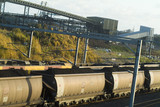 Mining Photo Stock Library - loaded coal rail carriages with conveyors at terminal in background. ( Weight: 3  New Image: NO)