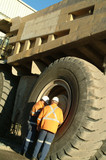 Mining Photo Stock Library - two male workers servicing a large truck tyre at a mine site. ( Weight: 3  New Image: NO)