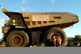 Mining Photo Stock Library - two male workers inspecting a large truck tyre at a mine site. ( Weight: 2  New Image: NO)
