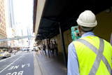 Mining Photo Stock Library - surveyor in PPE working inner city roads. ( Weight: 3  New Image: NO)