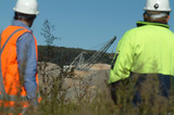 Mining Photo Stock Library - two mine workers in PPE standing amongst revegetation with dragline working in open cut coal mine pit behind. ( Weight: 3  New Image: NO)