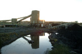 Mining Photo Stock Library - Sun setting over small coal wash plant. water storae dam in foreground ( Weight: 5  New Image: NO)