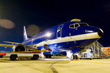 Mining Photo Stock Library - 747 plane on tarmac being loaded at night time. ( Weight: 3  New Image: NO)