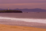 Mining Photo Stock Library - lighthouse on ocean headland with beach and waves in foreground.  shot at sunset. ( Weight: 2  New Image: NO)