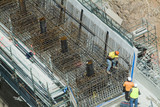 Mining Photo Stock Library - workers in teamwork preparing concrete steel formwork.  bridge or dam work. aerial shot. ( Weight: 1  New Image: NO)