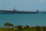 Mining Photo Stock Library - long jetty out to shipping wharf with dual coal conveyors.  blue ocean and green mangrove foliage in foreground. ( Weight: 1  New Image: NO)