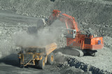 Mining Photo Stock Library - large digger excavator loading overburden into haul truck on open cut coal mine site.  close up shot with lots of dust. aerial shot ( Weight: 2  New Image: NO)