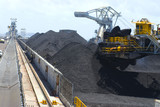 Mining Photo Stock Library - looking along coal reclaimer track on top of bunding with reclaimer operating on coal stockpiles. ( Weight: 3  New Image: NO)