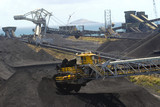 Mining Photo Stock Library - coal reclaimers and ship loaders working at terminal with coal stockpiles and the ocean in the background. aerial shot. ( Weight: 2  New Image: NO)