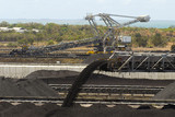Mining Photo Stock Library - close up of coal falling off a conveyor and being stockpiled.  lots of stockpiles in background.  great generic coal production image. ( Weight: 3  New Image: NO)