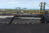 Mining Photo Stock Library - close up of coal falling off a conveyor and being stockpiled.  lots of stockpiles in background.   ( Weight: 4  New Image: NO)