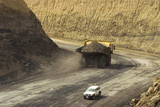 Mining Photo Stock Library - loaded haul truck passes light vehicle on haul road out of the floor of open cut mine. ( Weight: 1  New Image: NO)