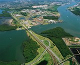 Mining Photo Stock Library - aerial view of city freeway, water treatment plant and mangrove river. ( Weight: 1  New Image: NO)
