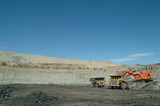 Mining Photo Stock Library - two haul truck rotation with excavator in open cut coal mine.  wide shot with high walls in background. ( Weight: 2  New Image: NO)