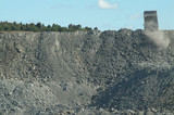 Mining Photo Stock Library - haul truck dumping overburden into a stockpile.  shot from a distance to give scale to open cut mine. ( Weight: 1  New Image: NO)