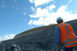 Mining Photo Stock Library - mine worker project manager observing high walls of open cut coal mine. ( Weight: 4  New Image: NO)