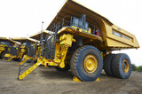 Mining Photo Stock Library - line of haul trucks at go line.  whell chocks in place. ( Weight: 2  New Image: NO)