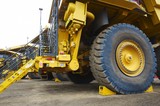 Mining Photo Stock Library - close up of haul truck on go line with a wheel chock. ( Weight: 2  New Image: NO)