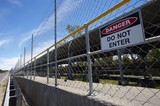 Mining Photo Stock Library - do not enter sign on fence of an overland coal conveyor ( Weight: 3  New Image: NO)