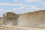 Mining Photo Stock Library - haul truck loaded with overburden in the pit of an open cut coal mine.  light vehicle passing by. ( Weight: 2  New Image: NO)