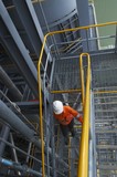 Mining Photo Stock Library - mine site worker in full ppe safely using stairs in a processing plant.  shot from above ( Weight: 2  New Image: NO)