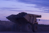 Mining Photo Stock Library - haul truck carrying overburden travelling through open cut coal mine at twilight. ( Weight: 1  New Image: NO)