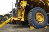 Mining Photo Stock Library - close up photo of haul trucks at go line stopped by wheel chocks ( Weight: 3  New Image: NO)
