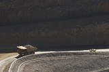 Mining Photo Stock Library - light vehicle follows loaded haul truck up haul road of a gold mine ( Weight: 1  New Image: NO)