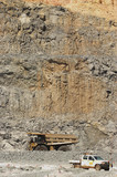 Mining Photo Stock Library - vertical shot of haul truck passing parked light vehicle inpuit of open cut gold mine. ( Weight: 1  New Image: NO)