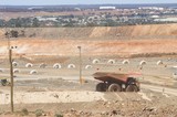 Mining Photo Stock Library - haul truck parked up at go line in open cut mine.  township of kalgoorlie in background ( Weight: 1  New Image: NO)