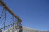 Mining Photo Stock Library - conveyor  up to stockpile with blue sky behind. ( Weight: 1  New Image: NO)
