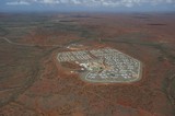 Mining Photo Stock Library - high aerial shot of 3000 person mine camp.  there is wilderness in background way back to horizon.  ( Weight: 1  New Image: NO)