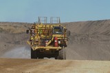 Mining Photo Stock Library - water truck spraying for dust suppression on haul road at open cut coal mine. ( Weight: 1  New Image: NO)