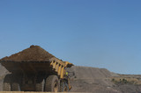 Mining Photo Stock Library - loaded haul truck with overburden heads to stockpile in open cut mine.  clear blue sky with plenty of space for copy. ( Weight: 1  New Image: NO)