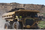 Mining Photo Stock Library - loaded haul truck in open cut mine carrying over burden with high stockpiles behind. ( Weight: 1  New Image: NO)