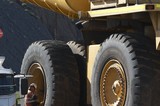 Mining Photo Stock Library - tyre fitter mine worker inspecting haul truck tyre.  great scale. ( Weight: 1  New Image: NO)