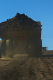 Mining Photo Stock Library - back of loaded haul truck on haul road with deep blue sky behind. ( Weight: 1  New Image: NO)