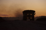 Mining Photo Stock Library - dusk shot of loaded haul trucks on haul road in open cut mine. ( Weight: 1  New Image: NO)