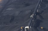 Mining Photo Stock Library - close up aerial photo of tractors stockpiling coal at shipping terminal.  conveyor working above to spread coal. ( Weight: 1  New Image: NO)