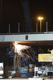 Mining Photo Stock Library - workers at night on civil infrastructure site grinding metal supports. lots of sparks.  workers in full PPE on EWP. ( Weight: 1  New Image: NO)