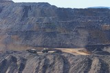 Mining Photo Stock Library - water cart and haul truck pass on mine site haul road.
wide photo with over burden stockpiles in background. ( Weight: 1  New Image: NO)