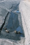 Mining Photo Stock Library - Vertical aerial photo of truck rotation in open cut coal mine.  Water cart in background spraying for dust suppression.  ( Weight: 1  New Image: NO)