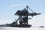 Mining Photo Stock Library - Silhouette of a coal ship loader and wharf with tug boat adjacent. ( Weight: 1  New Image: NO)